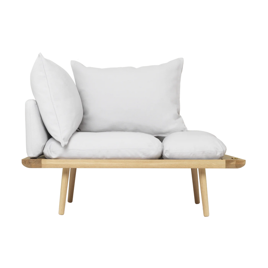 The Conversation Piece fabric armchair with natural frame