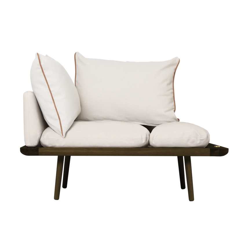 The Conversation Piece fabric armchair with natural frame