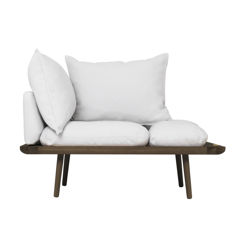 The Conversation Piece fabric armchair with natural frame