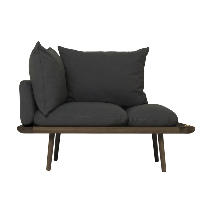 The Conversation Piece fabric armchair with natural frame