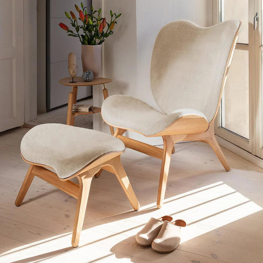 The Conversation Piece fabric footstool with natural frame