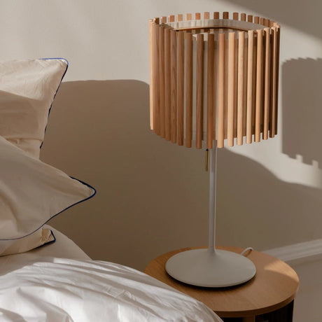 The Conversation Piece fabric armchair with natural frame