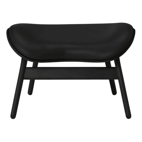 The Conversation Piece leather footstool with black frame