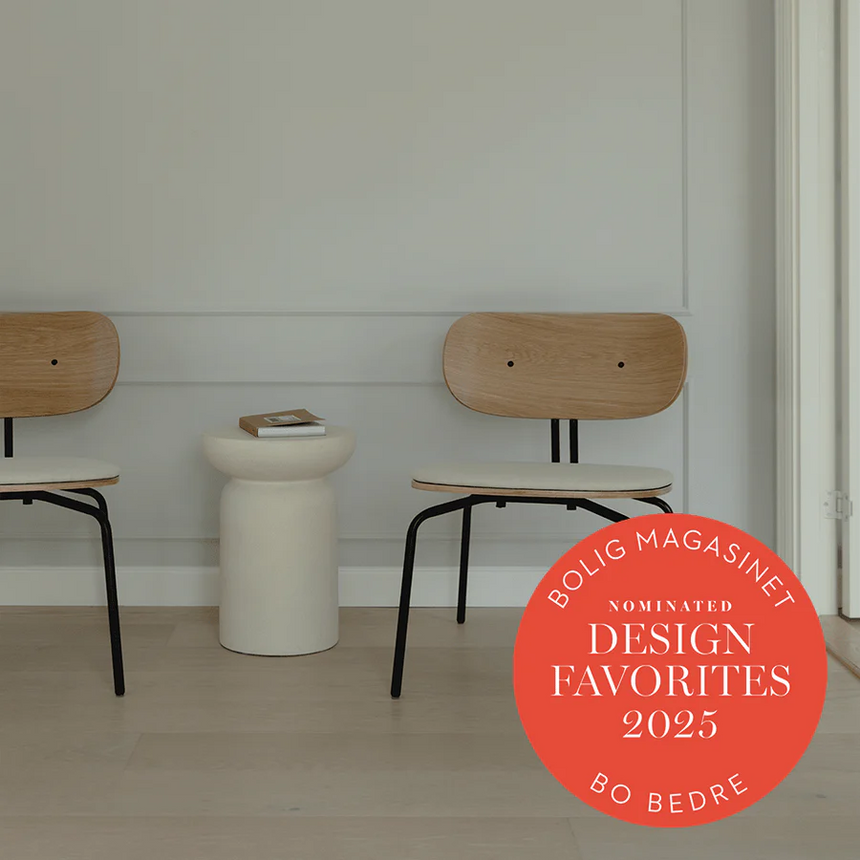The Conversation Piece fabric armchair with natural frame