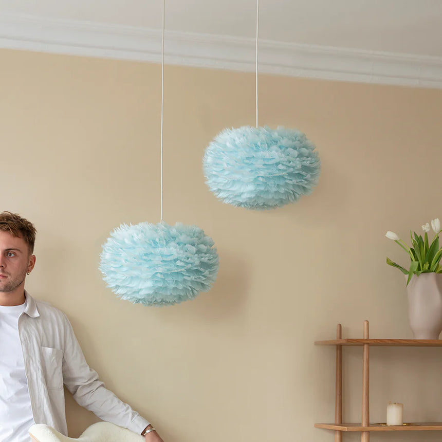 The Conversation Piece fabric armchair with natural frame