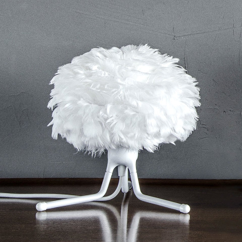 The Conversation Piece fabric armchair with natural frame