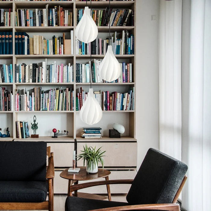 The Conversation Piece fabric armchair with natural frame