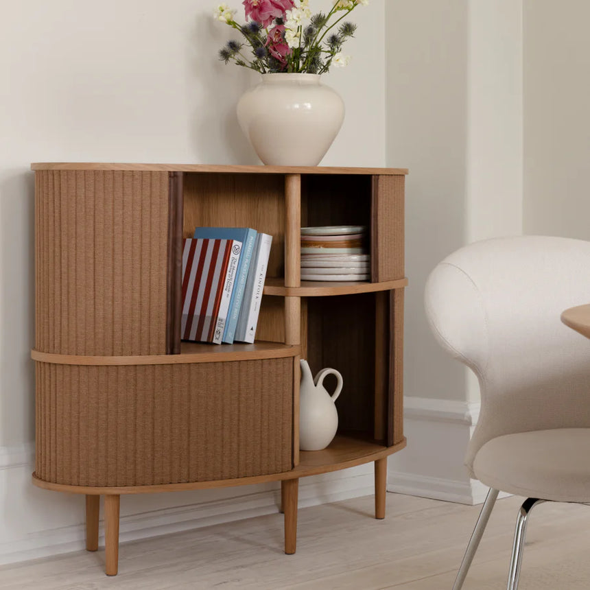 The Conversation Piece fabric armchair with natural frame