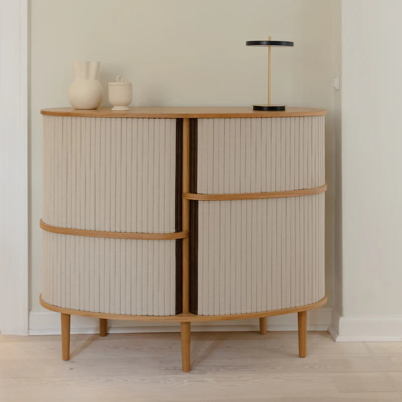 The Conversation Piece fabric armchair with natural frame