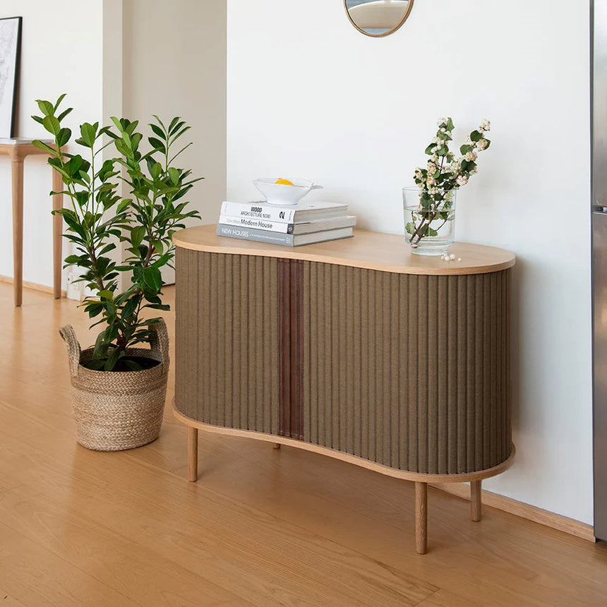 The Conversation Piece fabric armchair with natural frame