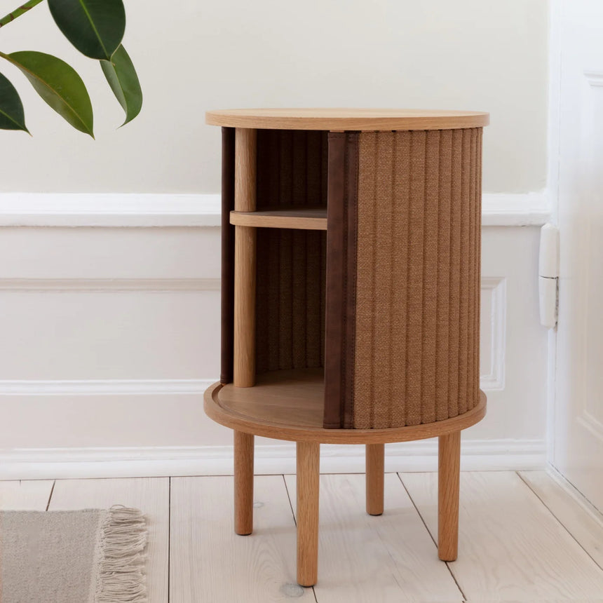 The Conversation Piece fabric armchair with natural frame
