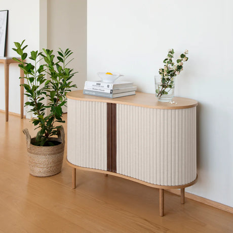 The Conversation Piece fabric armchair with natural frame