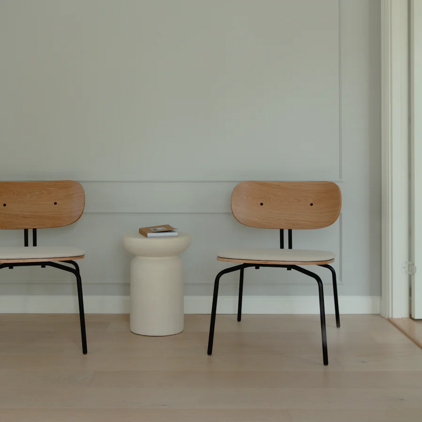 The Conversation Piece fabric armchair with natural frame