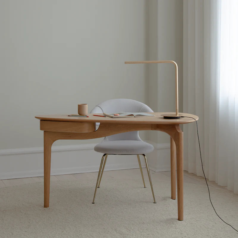 The Conversation Piece fabric armchair with natural frame