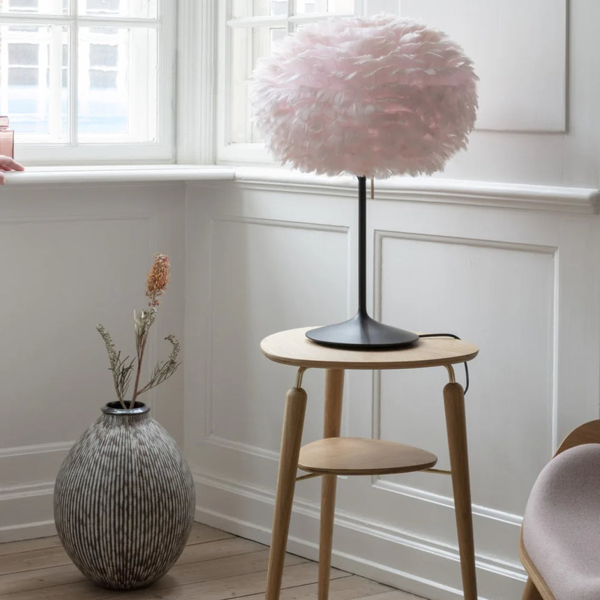 The Conversation Piece fabric armchair with natural frame