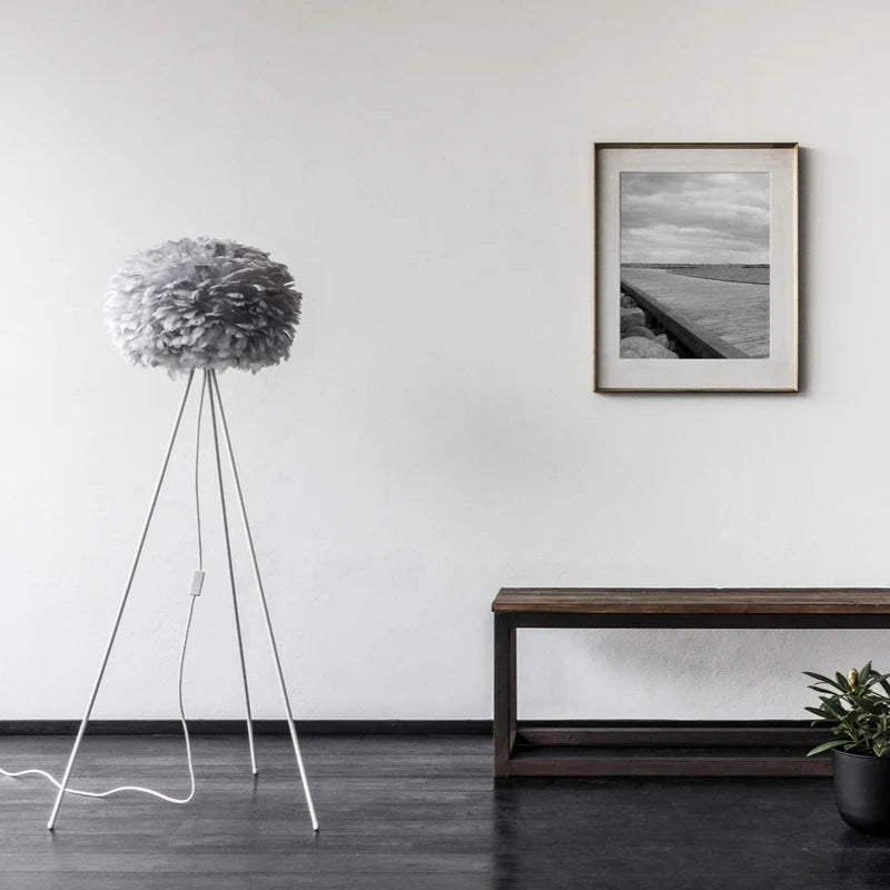 The Conversation Piece fabric armchair with natural frame