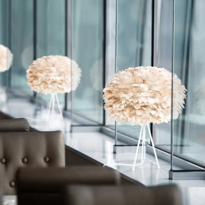 The Conversation Piece fabric armchair with natural frame