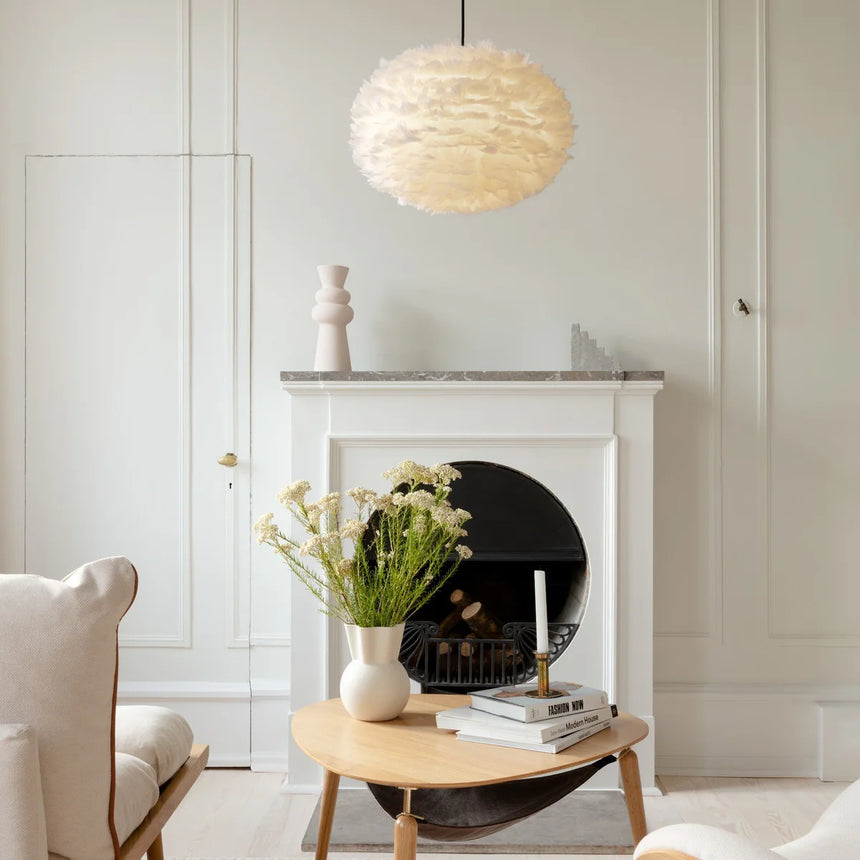 The Conversation Piece fabric armchair with natural frame