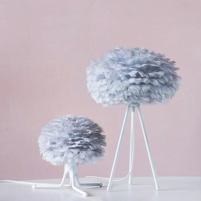 The Conversation Piece fabric armchair with natural frame