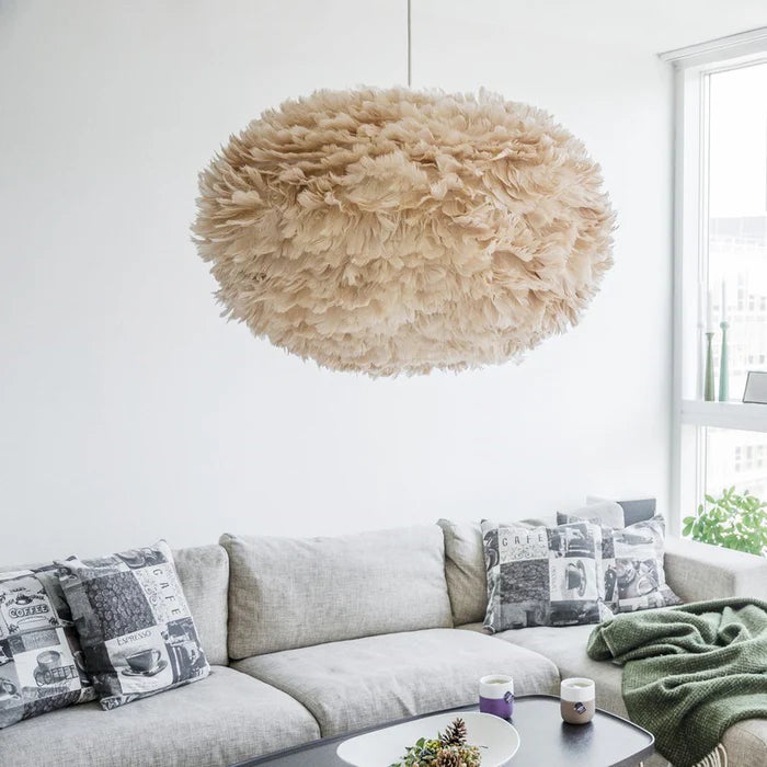 The Conversation Piece fabric armchair with natural frame