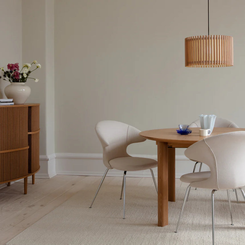 The Conversation Piece fabric armchair with natural frame