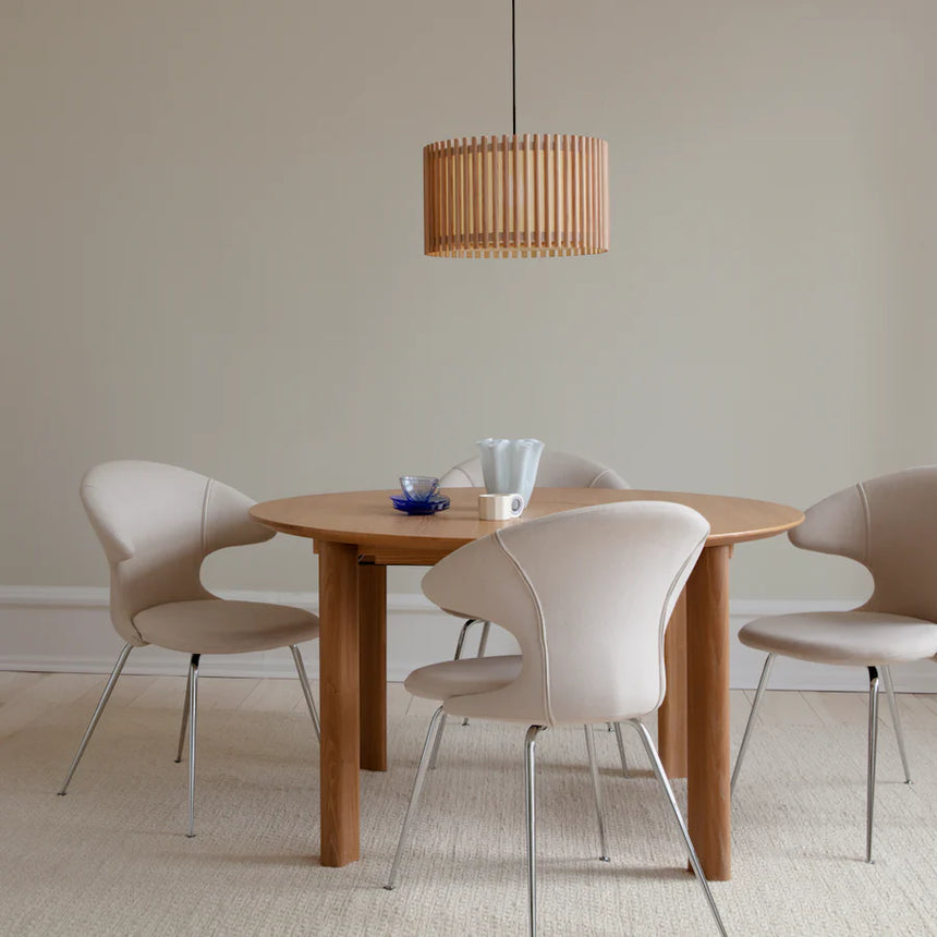 The Conversation Piece fabric armchair with natural frame