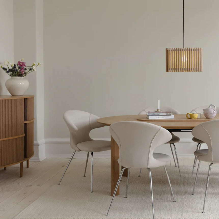 The Conversation Piece fabric armchair with natural frame