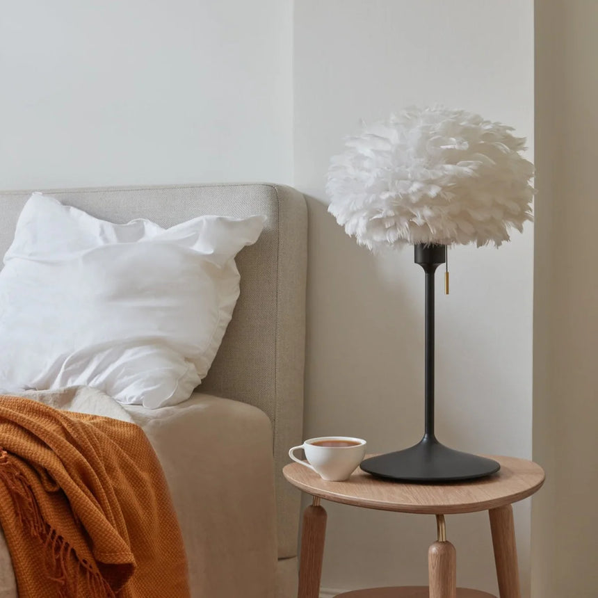 The Conversation Piece fabric armchair with natural frame