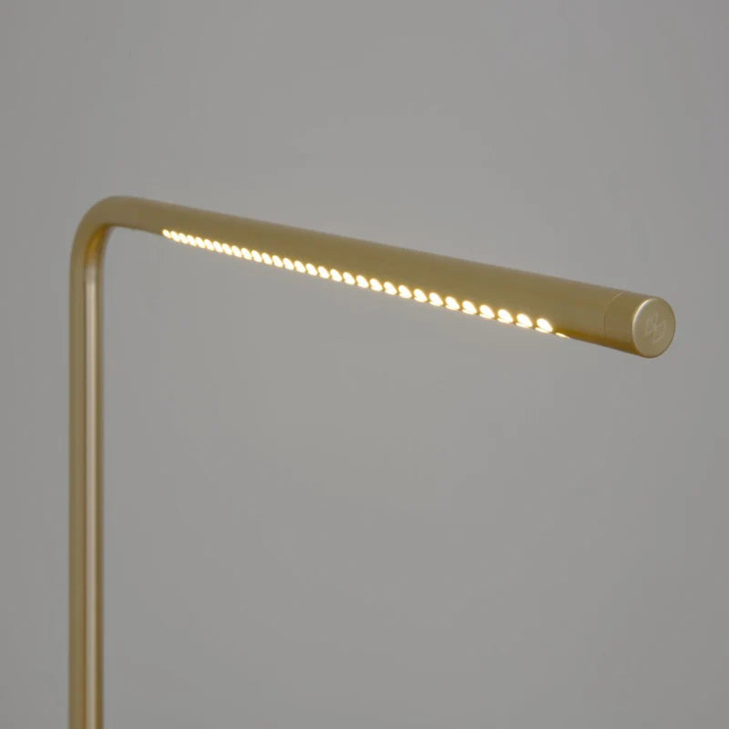 The Conversation Piece fabric armchair with natural frame