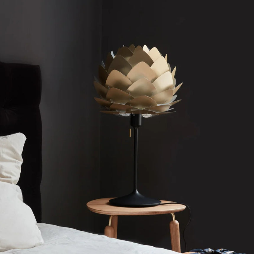 The Conversation Piece fabric armchair with natural frame
