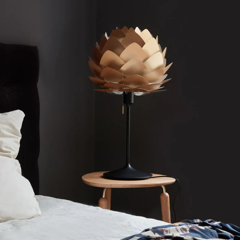 The Conversation Piece fabric armchair with natural frame