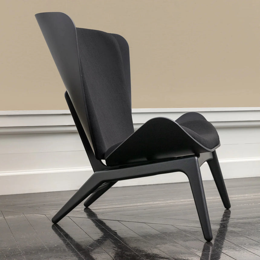 The Conversation Piece fabric armchair with natural frame