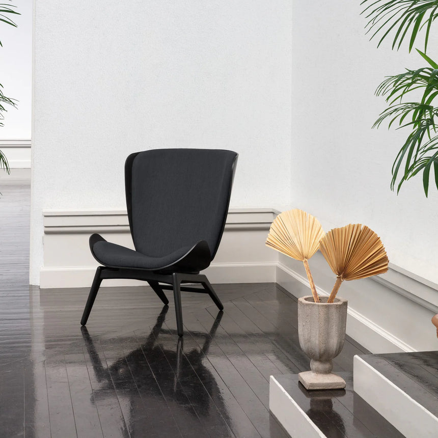 The Conversation Piece fabric armchair with natural frame
