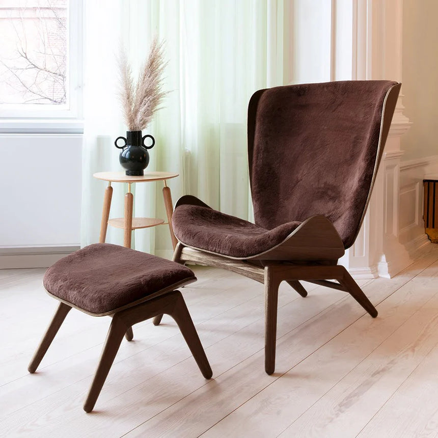The Conversation Piece fabric armchair with natural frame