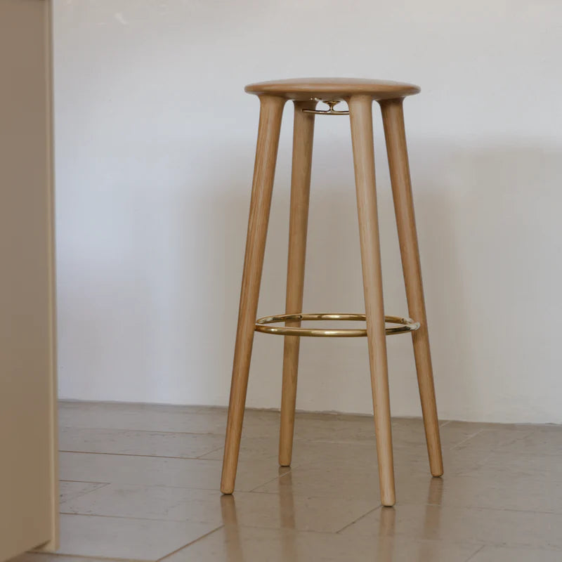The Conversation Piece fabric armchair with natural frame