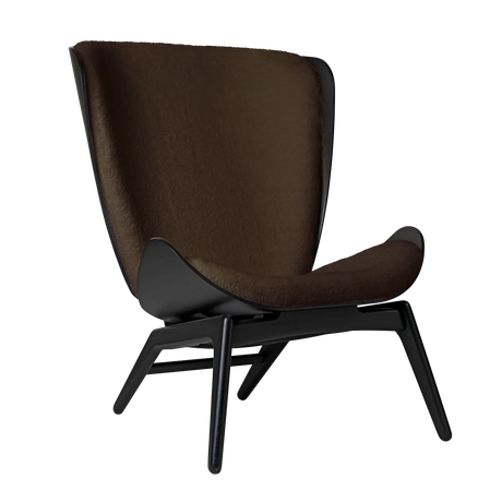 The Conversation Piece fabric armchair with natural frame