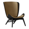 The Conversation Piece fabric armchair with natural frame