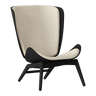 The Conversation Piece fabric armchair with natural frame