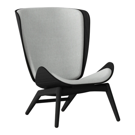 The Conversation Piece fabric armchair with natural frame