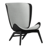 The Conversation Piece fabric armchair with natural frame