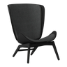 The Conversation Piece fabric armchair with natural frame