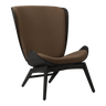 The Conversation Piece fabric armchair with natural frame