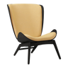 The Conversation Piece fabric armchair with natural frame