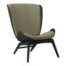 The Conversation Piece fabric armchair with natural frame