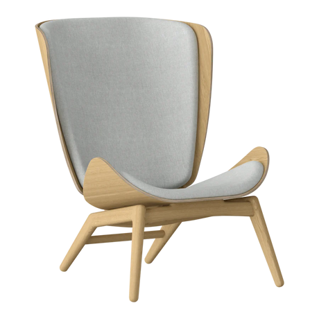 The Conversation Piece fabric armchair with natural frame