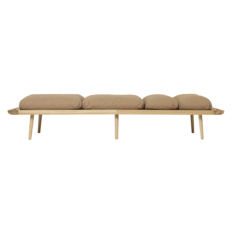 The Conversation Piece fabric armchair with natural frame