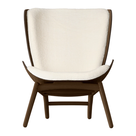 The Conversation Piece fabric armchair with natural frame
