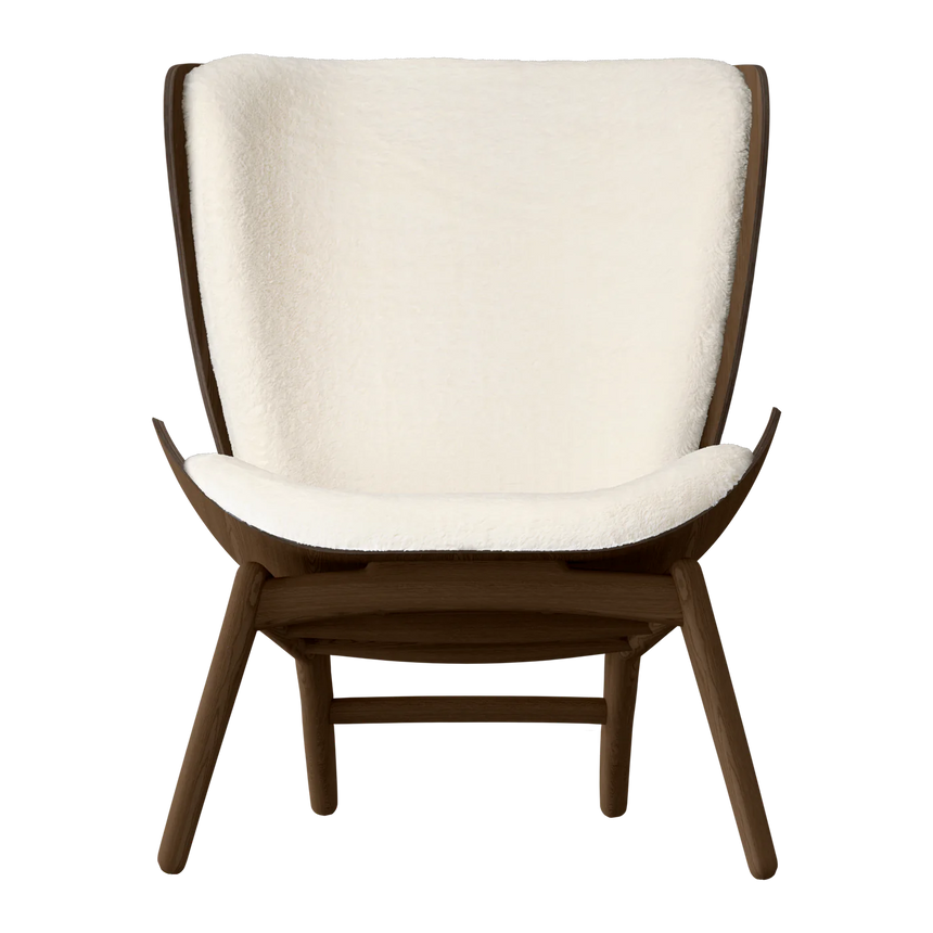 The Conversation Piece fabric armchair with natural frame