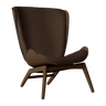 The Conversation Piece fabric armchair with natural frame