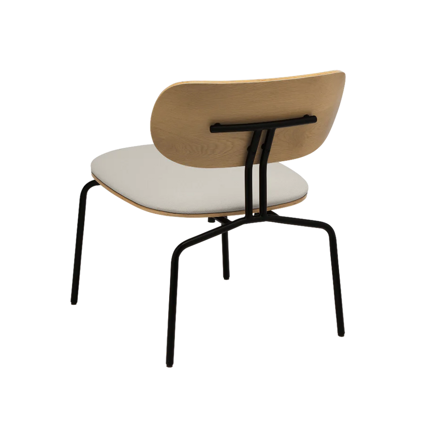 The Conversation Piece fabric armchair with natural frame